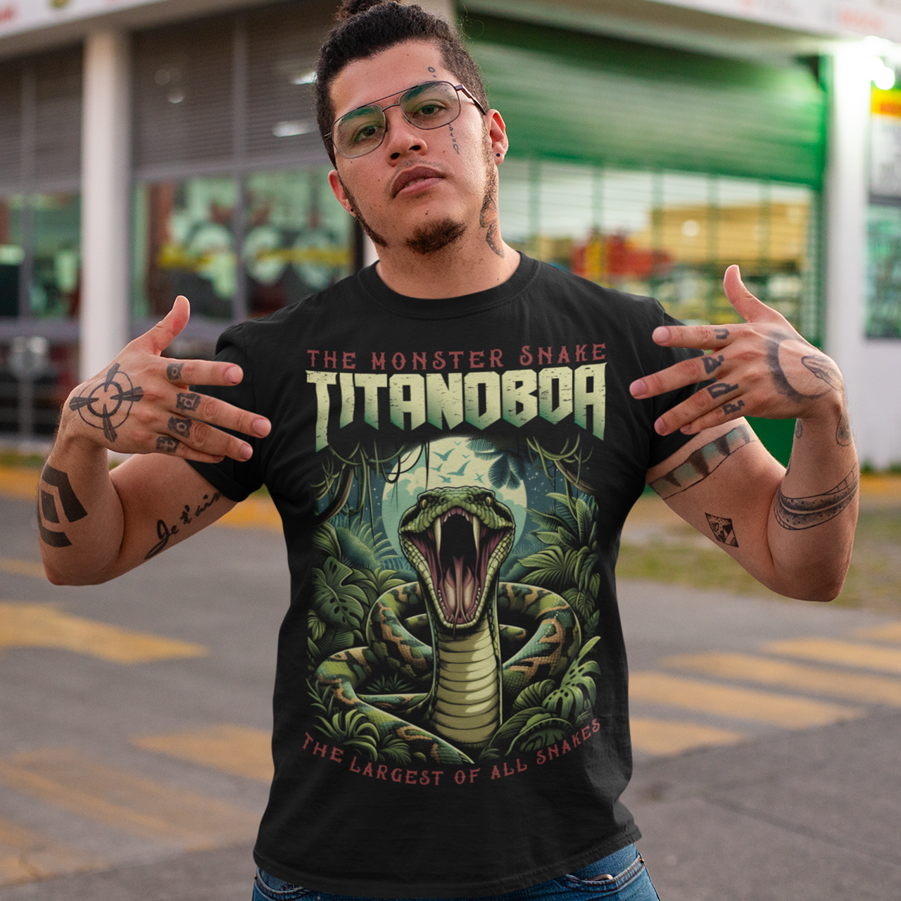 Black t-shirt of a boa constrictor with text above THE MONSTER SNAKE TITANOBOA.