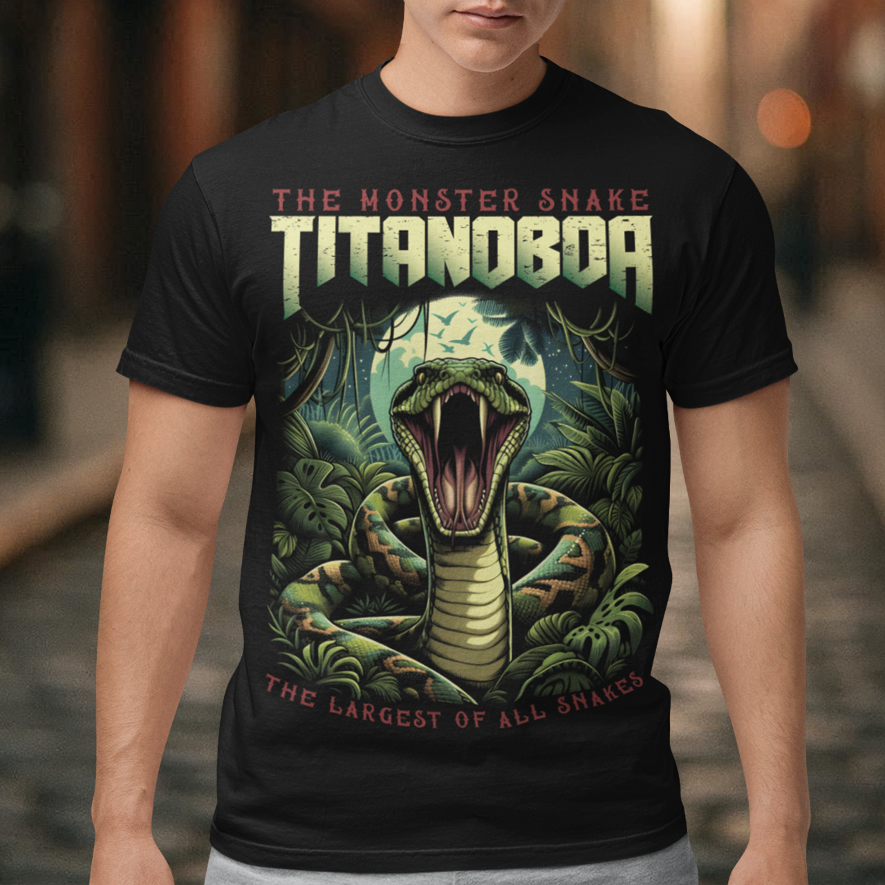 Unleash your wild side with our exclusive Titanoboa t-shirt, featuring a striking and lifelike illustration of a boa constrictor in all its majestic glory. The detailed artwork captures the essence of this ancient, colossal serpent, with scales so realistic you can almost feel them. Above the formidable snake, bold and powerful text reads "THE MONSTER SNAKE TITANOBOA," making a clear statement that commands attention. Perfect for snake enthusiasts