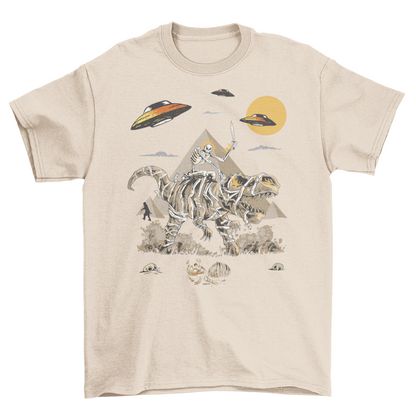 Cream t-shirt with a skeleton riding a mummy dinosaur in ancient Egypt with aliens and bigfoot.