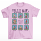 Pink t-shirt of cartoon medieval vegetables in select boxes with text on top VEGGIE WARS and text in the center VEGGIE SELECT.