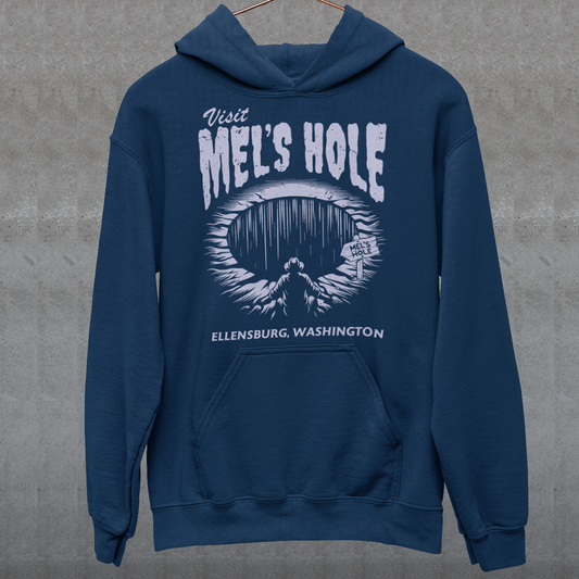 Step into the strange with this quirky and mysterious hoodie! Featuring a bold illustration of a curious man peering into a dark, bottomless abyss, this hoodie pays homage to the legendary paranormal tale of Mel's Hole — a supposed infinite pit in the wilds of Washington State. The vintage-style artwork is topped with the eerie invitation: "VISIT MEL'S HOLE" in retro tourism font, blending humor, folklore, and a dash of the unexplained.