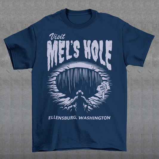 Step into the strange with this quirky and mysterious tee! Featuring a bold illustration of a curious man peering into a dark, bottomless abyss, this shirt pays homage to the legendary paranormal tale of Mel's Hole — a supposed infinite pit in the wilds of Washington State. The vintage-style artwork is topped with the eerie invitation: "VISIT MEL'S HOLE" in retro tourism font, blending humor, folklore, and a dash of the unexplained.