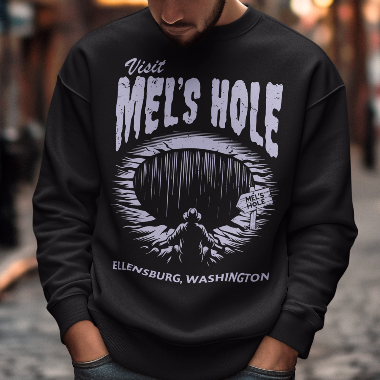 Step into the strange with this quirky and mysterious shirt! Featuring a bold illustration of a curious man peering into a dark, bottomless abyss, this shirt pays homage to the legendary paranormal tale of&nbsp;Mel's Hole — a supposed infinite pit in the wilds of Washington State. The vintage-style artwork is topped with the eerie invitation: "VISIT MEL'S HOLE" in retro tourism font, blending humor, folklore, and a dash of the unexplained.