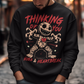 Dark humor meets twisted sweetness with this bold sweatshirt. Featuring a stitched-up voodoo doll at the center, the design captures that perfect mix of love and pain. Above the doll, the phrase “THINKING OF YOU” adds a playful sting, while below, “HUGS &amp; HEARTBREAK” ties it all together with equal parts irony and affection. Perfect for anyone who loves edgy, alternative fashion—or just wants to send a cheeky message without saying a word.