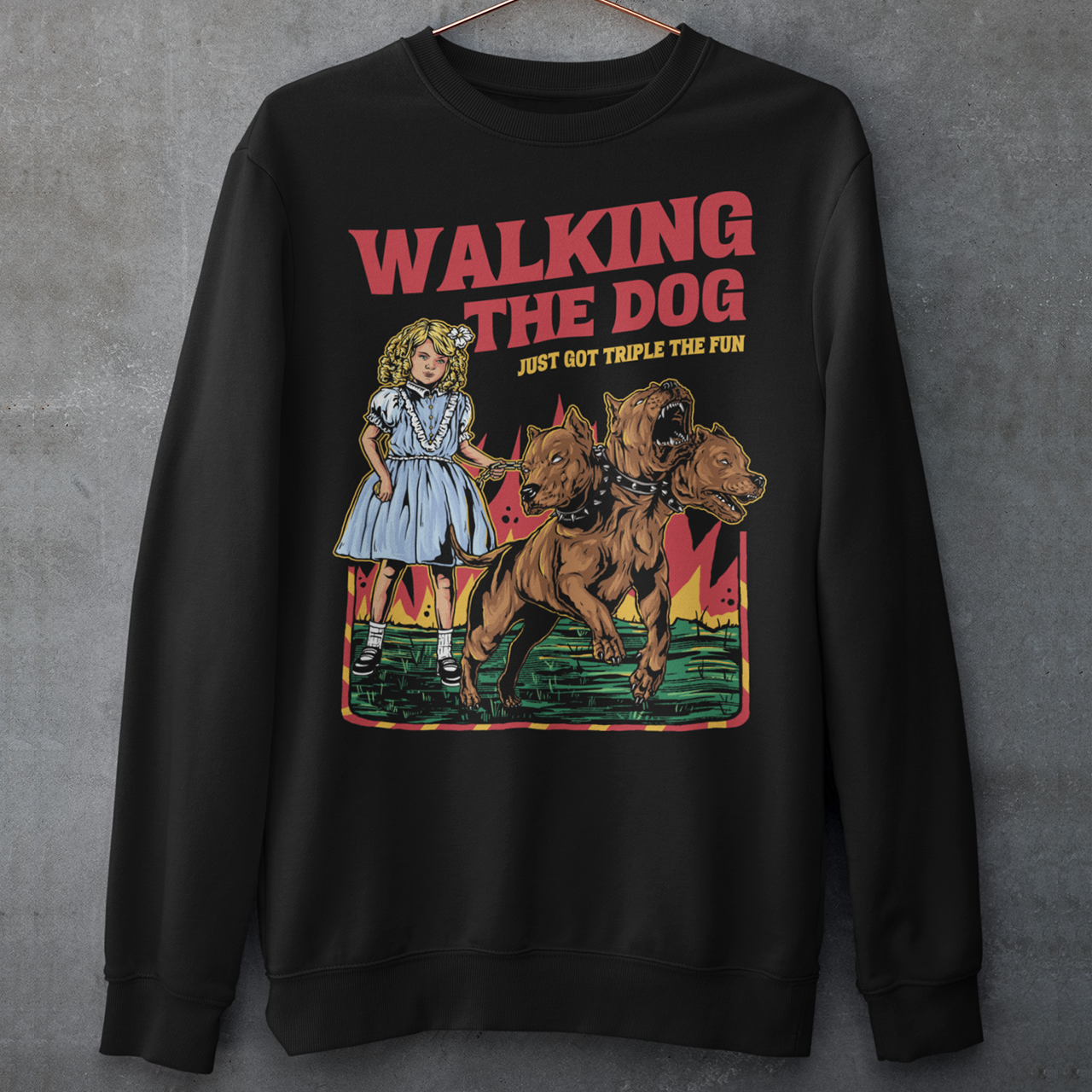 Black sweatshirt of a girl taking Cerberus dog for a walk with text WALKING THE DOG JUST GOT TRIPLE THE FUN.