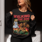 Black sweatshirt of a girl taking Cerberus dog for a walk with text WALKING THE DOG JUST GOT TRIPLE THE FUN.