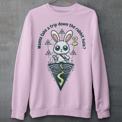 Introducing our one-of-a-kind sweatshirt design that's sure to turn heads and spark conversations wherever you go! Picture this: a mysterious rabbit, with an enigmatic glint in its eye, standing poised at the entrance of a deep rabbit hole. Its ears perked up, as if listening for secrets only it knows. Above this captivating scene, bold text reads: "WANNA TAKE A TRIP DOWN THE RABBIT HOLE." Embrace your inner conspiracy theorist and invite others to join you on a journey into the unknown.