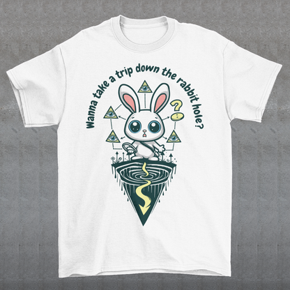 Introducing our one-of-a-kind t-shirt design that's sure to turn heads and spark conversations wherever you go! Picture this: a mysterious rabbit, with an enigmatic glint in its eye, standing poised at the entrance of a deep rabbit hole. Its ears perked up, as if listening for secrets only it knows. Above this captivating scene, bold text reads: "WANNA TAKE A TRIP DOWN THE RABBIT HOLE." Embrace your inner conspiracy theorist and invite others to join you on a journey into the unknown.