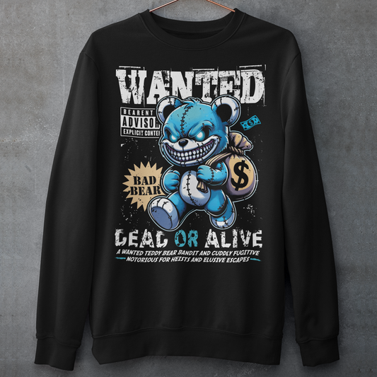 Turn heads with this bold and playful graphic sweatshirt featuring a mischievous teddy bear caught in the act! The design showcases a cartoon-style teddy bear sneaking away with a bag of money. Above the bear reads “WANTED”, while below it warns “DEAD OR ALIVE” giving it a vintage outlaw poster vibe with a fun, lighthearted twist.