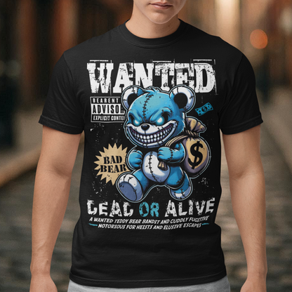Turn heads with this bold and playful graphic tee featuring a mischievous teddy bear caught in the act! The design showcases a cartoon-style teddy bear sneaking away with a bag of money. Above the bear reads “WANTED”, while below it warns “DEAD OR ALIVE” giving it a vintage outlaw poster vibe with a fun, lighthearted twist.