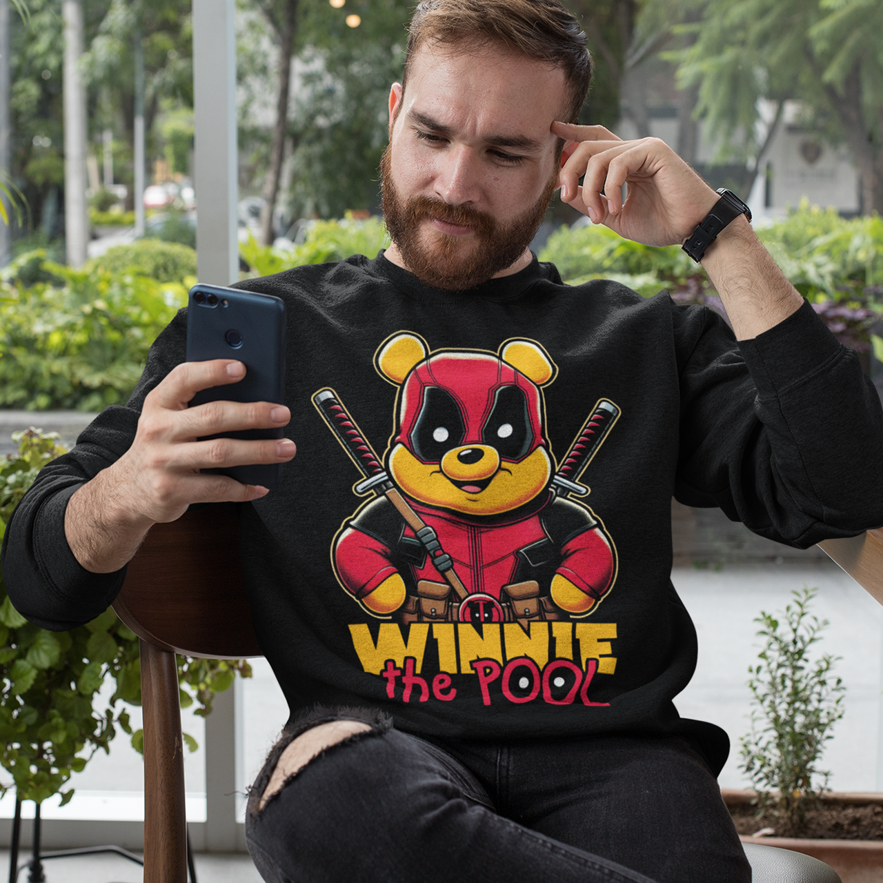 Black sweatshirt of Winnie the pooh dressed as a mercenary with samurai swords and text underneath "WINNIE THE POOL".