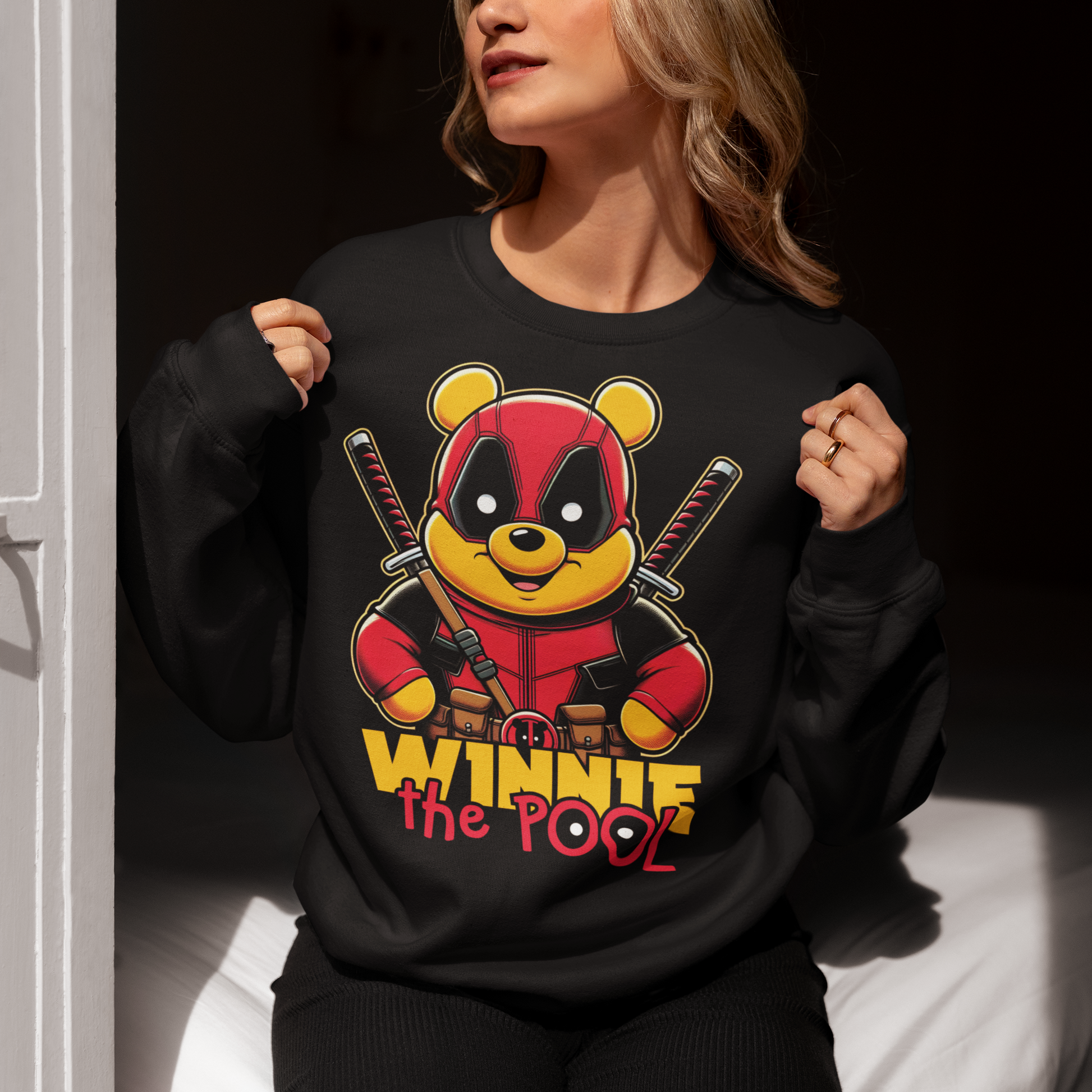 Black sweatshirt of Winnie the pooh dressed as a mercenary with samurai swords and text underneath "WINNIE THE POOL".