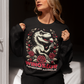 Black sweatshirt of a T-Rex drinking wine with text below WINOSAUR PREHISTORIC ALCOHOLIC.