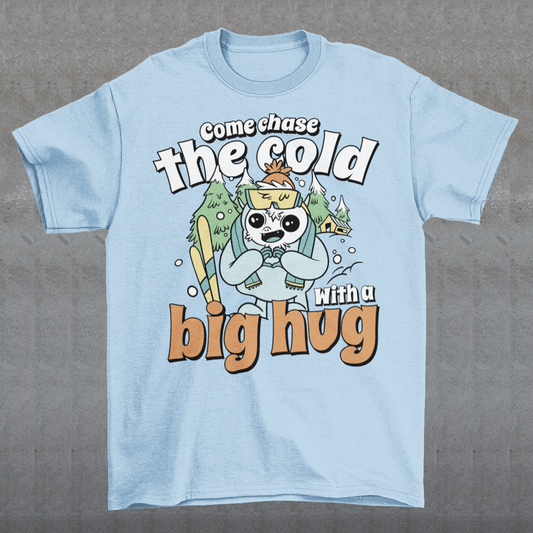 Hit the slopes in style with this playful Yeti Skiing t-shirt! Featuring a whimsical illustration of a friendly yeti standing in the snow, this design pairs perfectly with the cozy, heartwarming message: "Come chase the cold with a big hug." Whether you're a winter sports enthusiast or just love mythical creatures with a soft side, this tee wraps comfort, humor, and chill vibes into one awesome package.