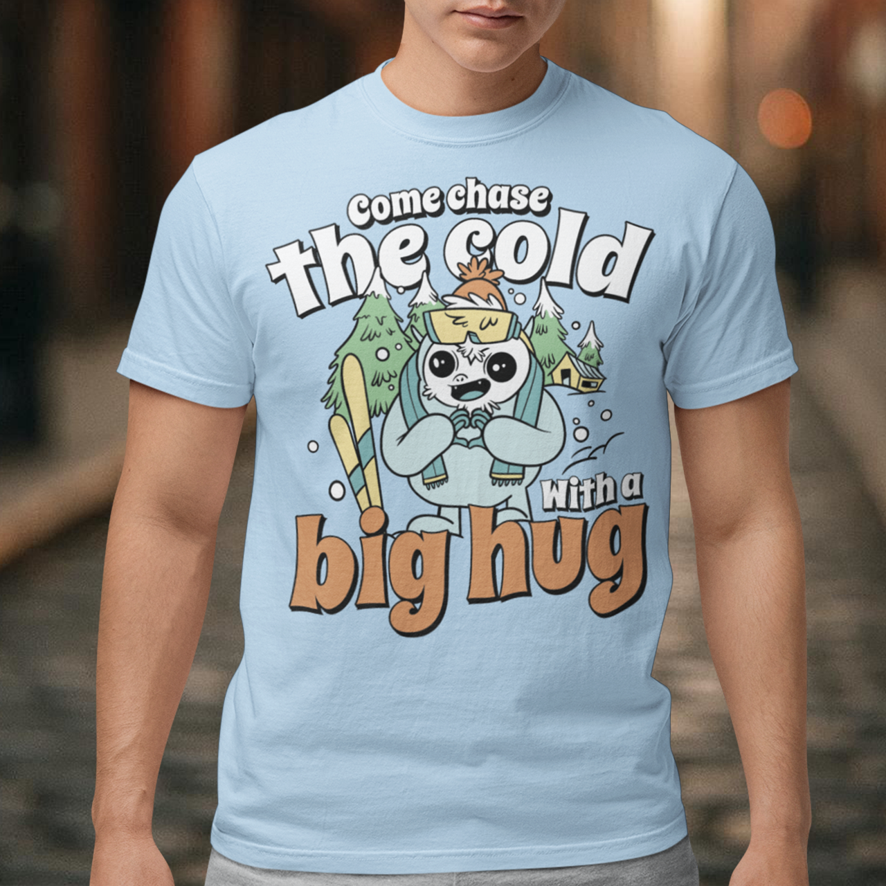 Hit the slopes in style with this playful Yeti Skiing t-shirt! Featuring a whimsical illustration of a friendly yeti standing in the snow, this design pairs perfectly with the cozy, heartwarming message: "Come chase the cold with a big hug." Whether you're a winter sports enthusiast or just love mythical creatures with a soft side, this tee wraps comfort, humor, and chill vibes into one awesome package.