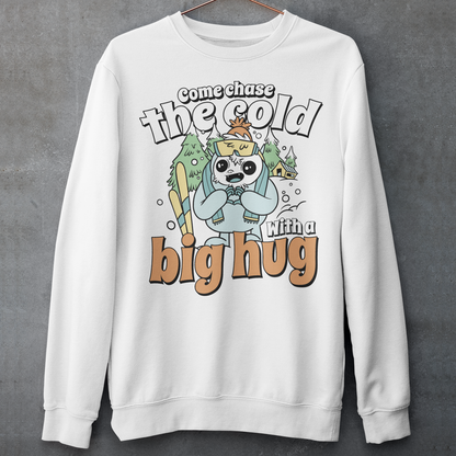 Hit the slopes in style with this playful Yeti Skiing sweatshirt! Featuring a whimsical illustration of a friendly yeti standing in the snow, this design pairs perfectly with the cozy, heartwarming message: "Come chase the cold with a big hug." Whether you're a winter sports enthusiast or just love mythical creatures with a soft side, this tee wraps comfort, humor, and chill vibes into one awesome package.